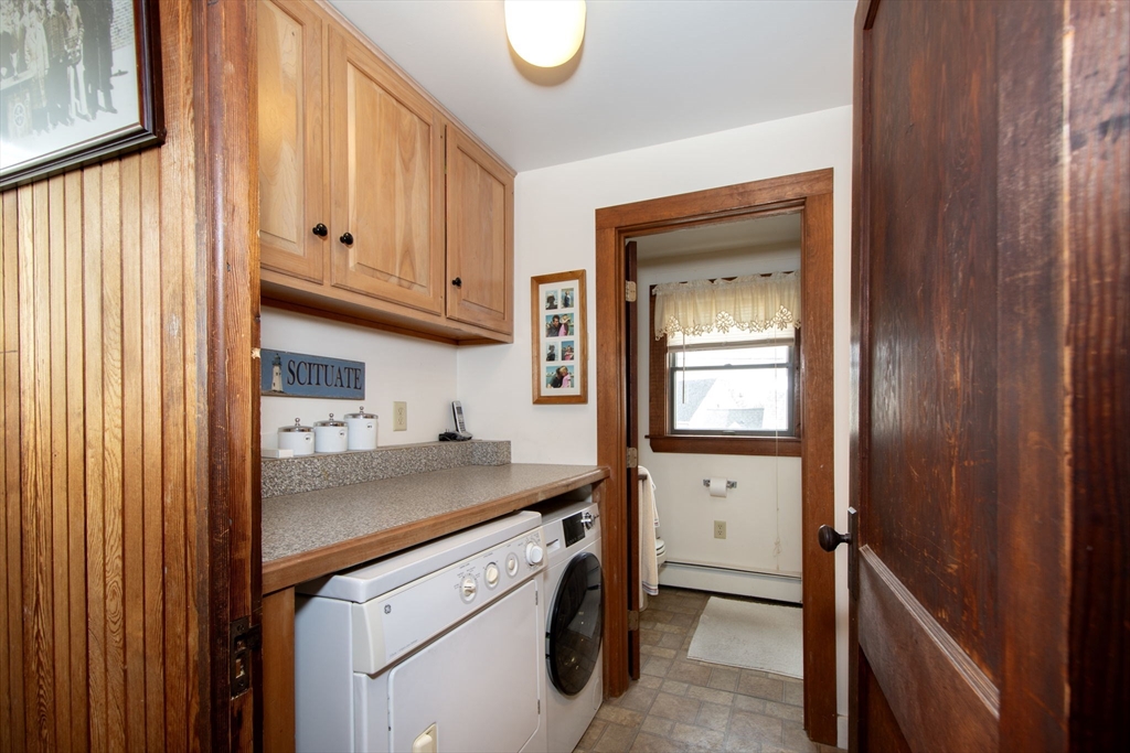 42 Lighthouse Road Scituate, MA 02066 - Photo 25 of 27 a utility room with a sink a washer and dryer