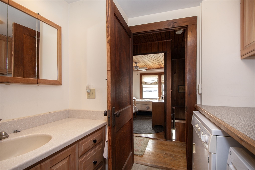 42 Lighthouse Road Scituate, MA 02066 - Photo 26 of 27 a kitchen with a sink and a refrigerator