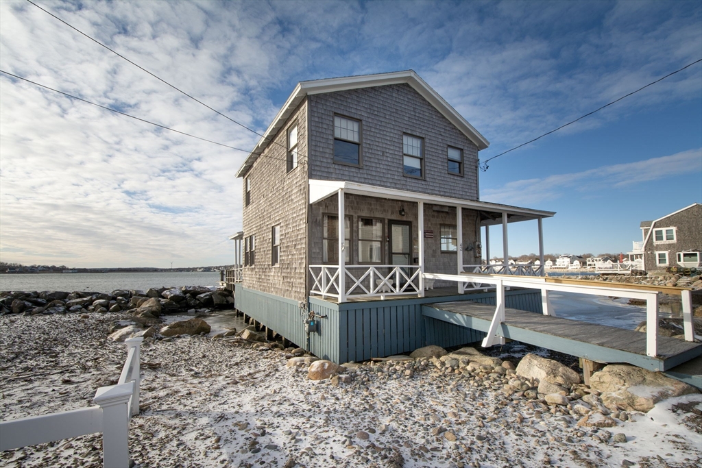 42 Lighthouse Road Scituate, MA 02066 - Photo 5 of 27 a view of a house with a roof deck