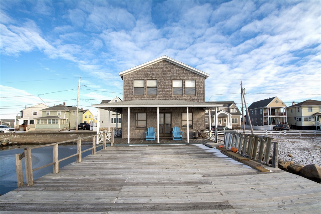 42 Lighthouse Road Scituate, MA 02066 - Photo 7 of 27 a view of a house with a wooden deck