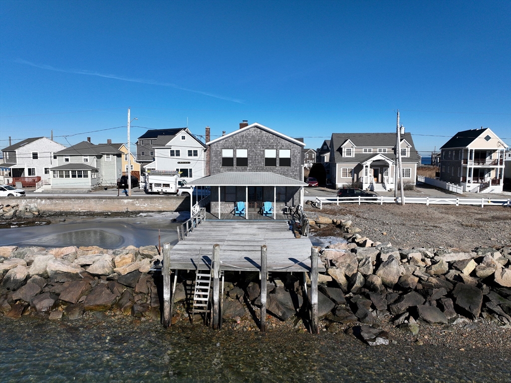 42 Lighthouse Road Scituate, MA 02066 - Photo 10 of 27 a front view of a house with a yard outdoor space and seating area