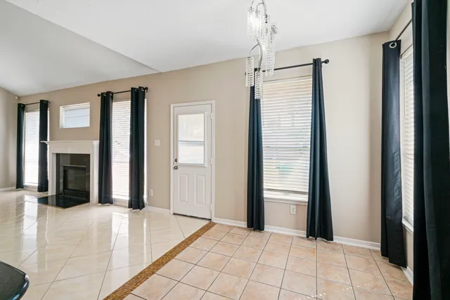 a view of a room with an entryway and livingroom view