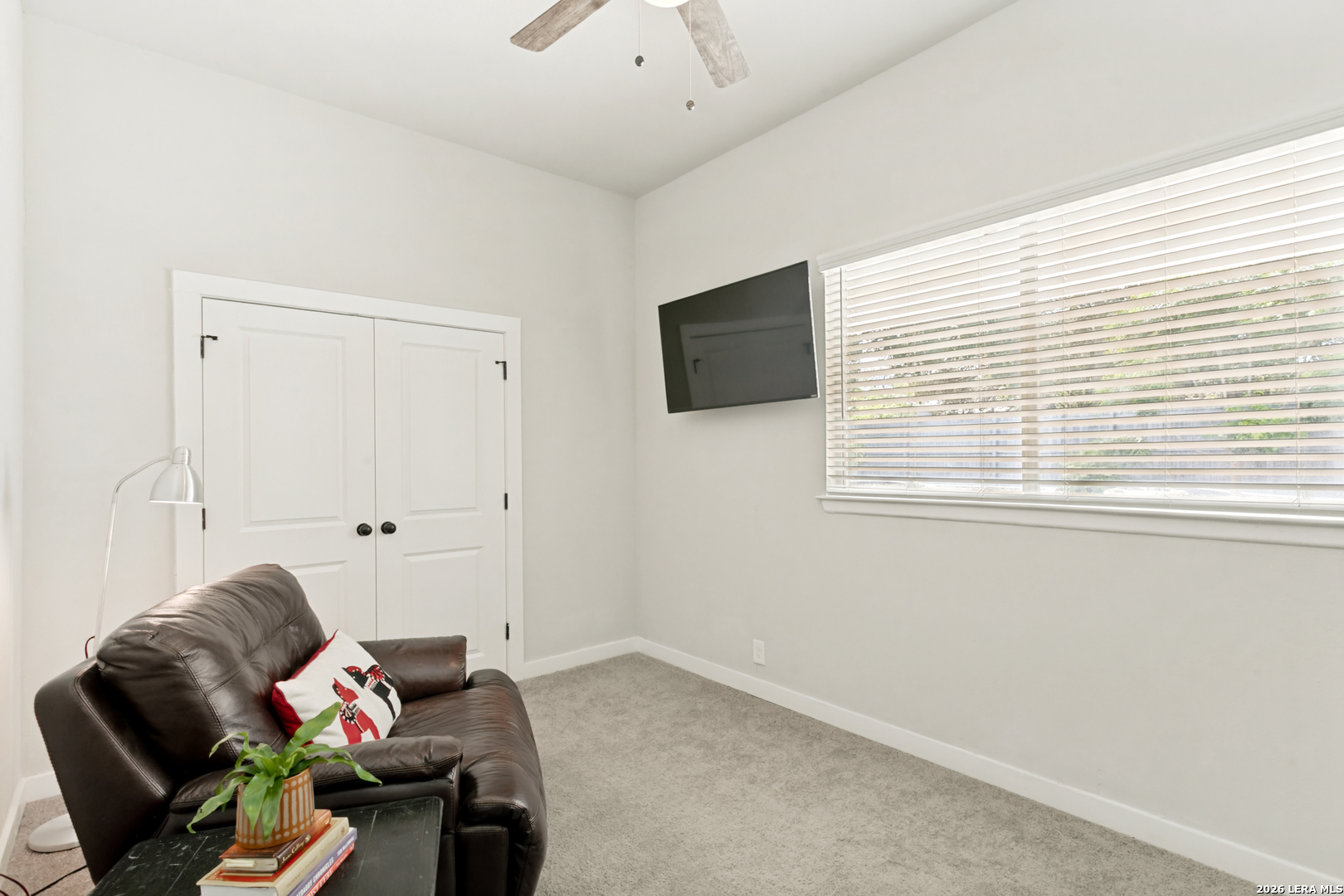 102 Silver Spring Universal City, TX 78148 - Photo 25 of 36 a living room with furniture and a flat screen tv