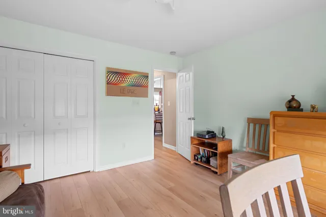 a room with furniture and a baby crib