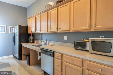 a front view of a house with swimming pool and sitting area