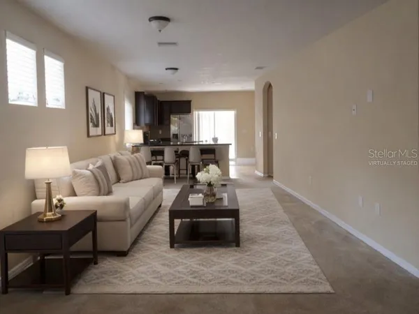 a living room with furniture and a window