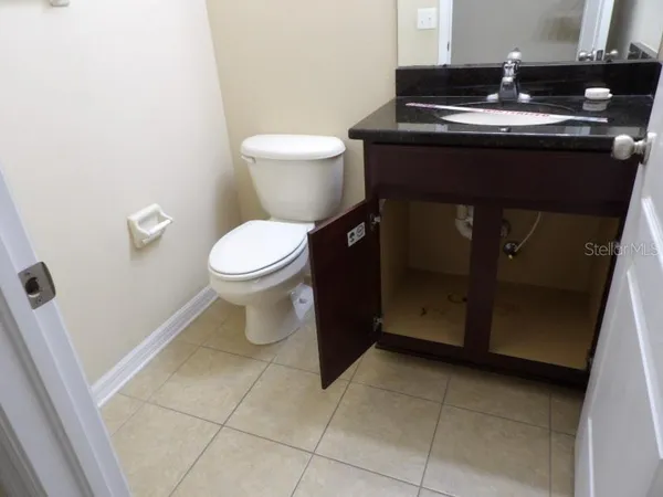 a bathroom with a toilet and a sink