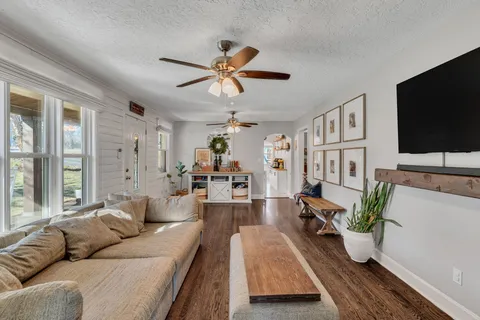 a living room with furniture and a flat screen tv