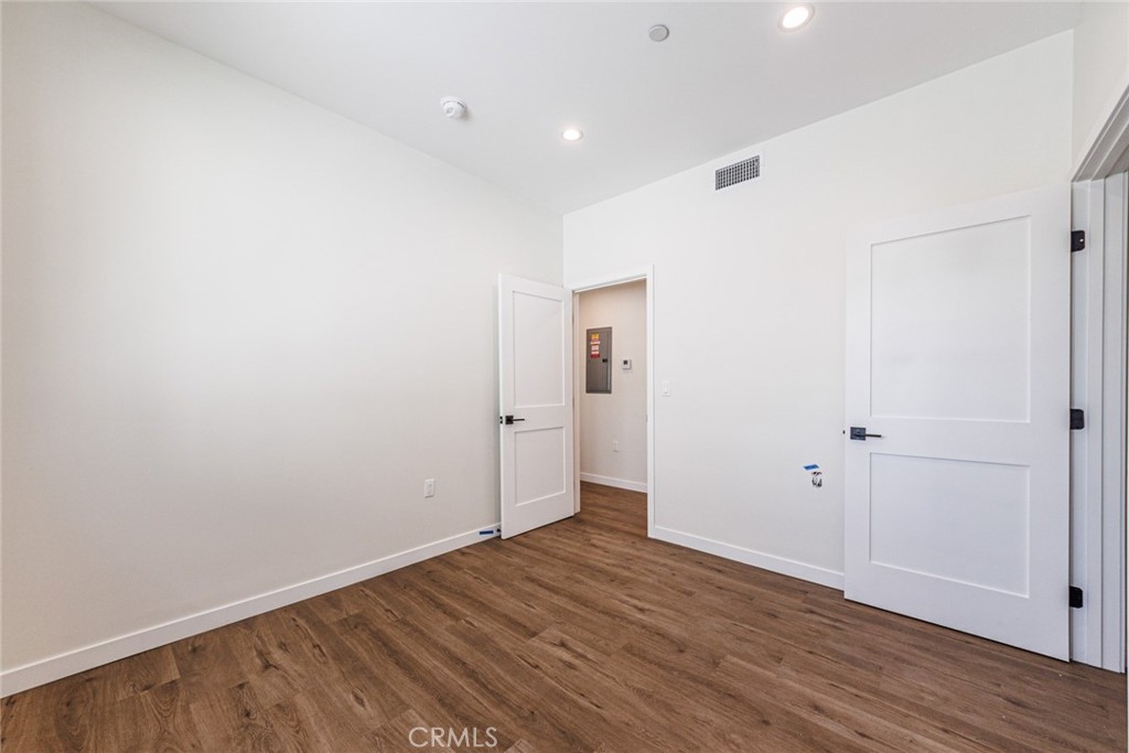 1855 Crenshaw Boulevard Los Angeles, CA 90019 - Photo 13 of 22 a view of an empty room with wooden floor