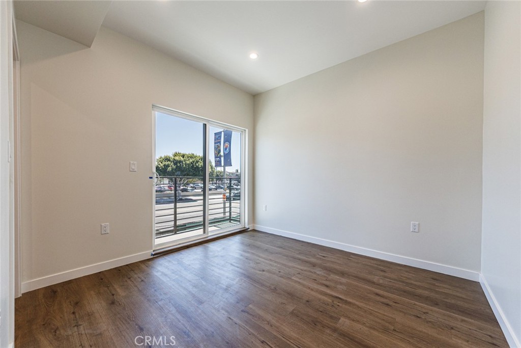 1855 Crenshaw Boulevard Los Angeles, CA 90019 - Photo 18 of 22 a view of a room with wooden floor and window