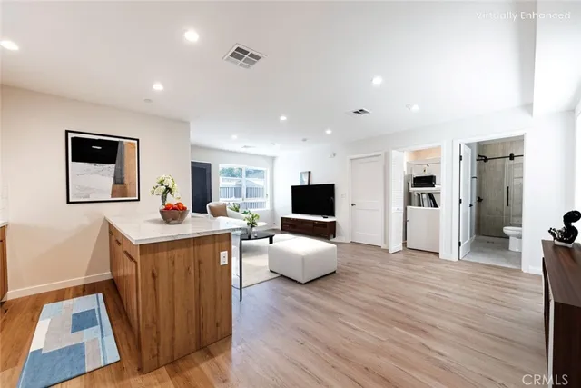 a view of living room with furniture and flat screen tv