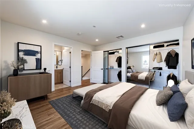 a bedroom with a large bed and a couch