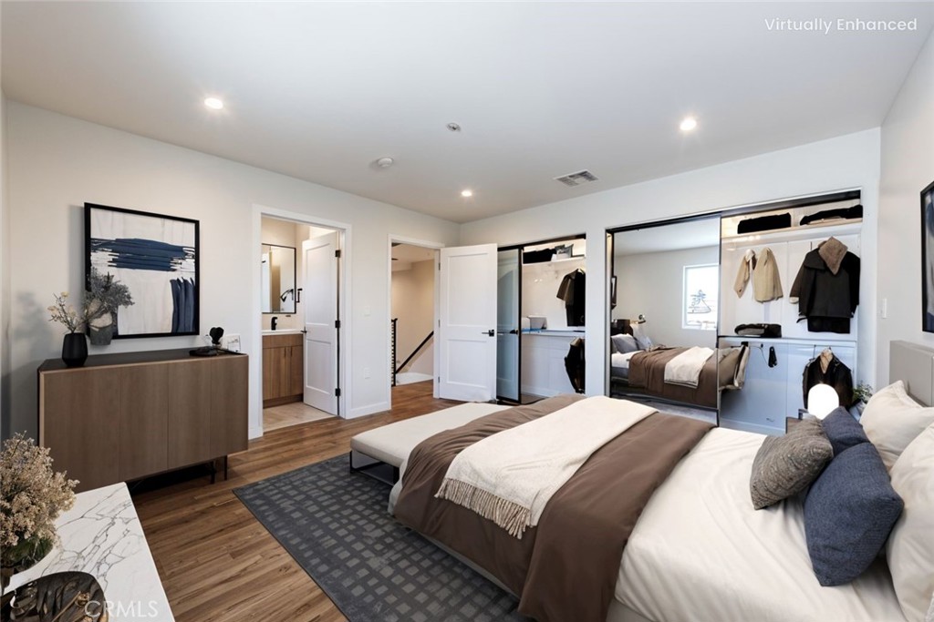 1855 Crenshaw Boulevard Los Angeles, CA 90019 - Photo 4 of 22 a bedroom with a large bed and a couch