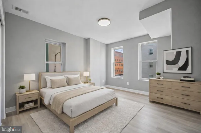 a bedroom with a bed and dresser