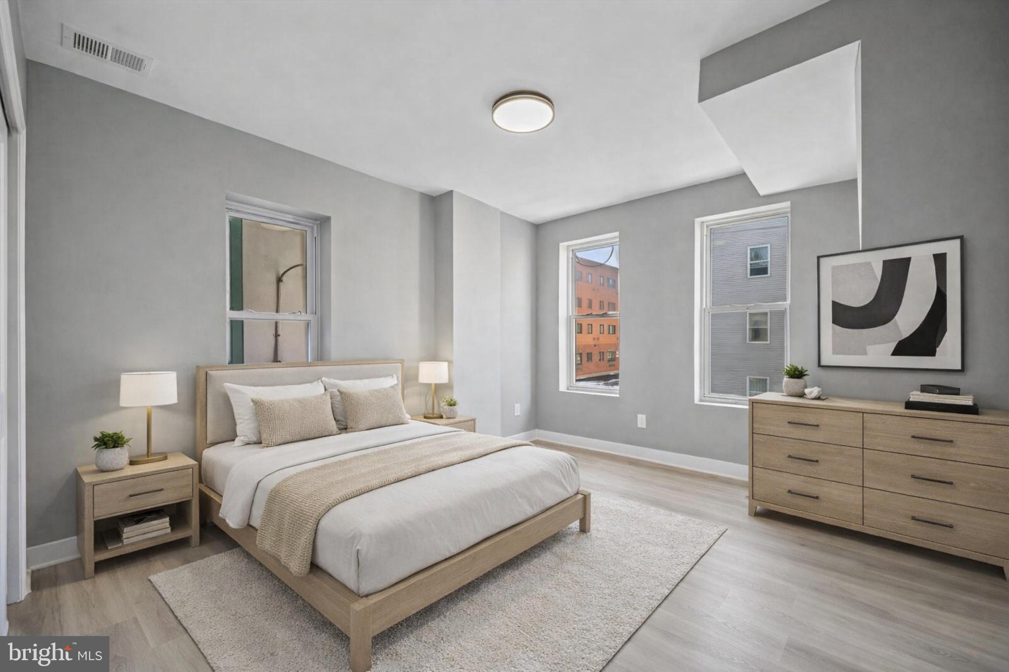 4542 Sansom Street Philadelphia, PA 19139 - Photo 15 of 36 a bedroom with a bed and dresser