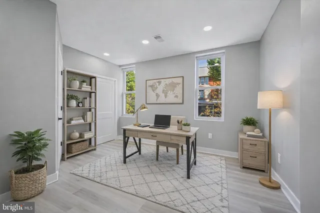 a workspace with furniture and window