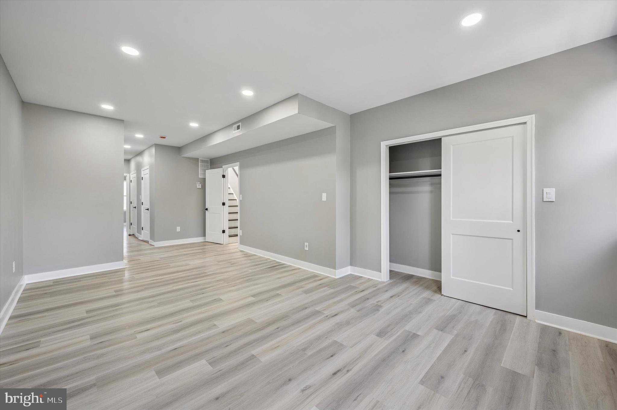 4542 Sansom Street Philadelphia, PA 19139 - Photo 19 of 36 a view of an empty room with wooden floor