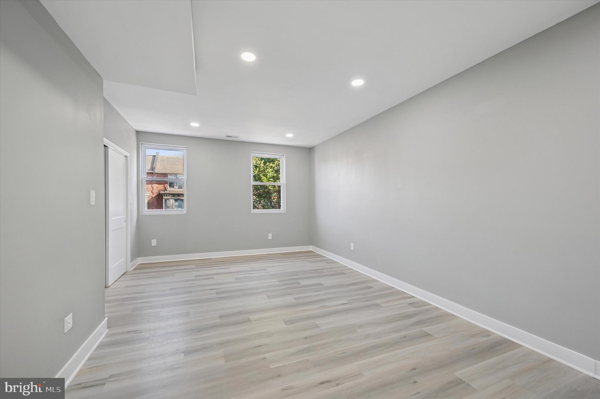 4542 Sansom Street Philadelphia, PA 19139 - Photo 24 of 36 an empty room with windows and closet