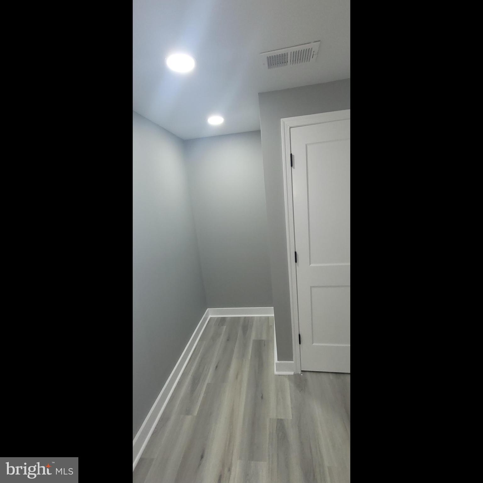 4542 Sansom Street Philadelphia, PA 19139 - Photo 25 of 36 a view of an empty room with wooden floor