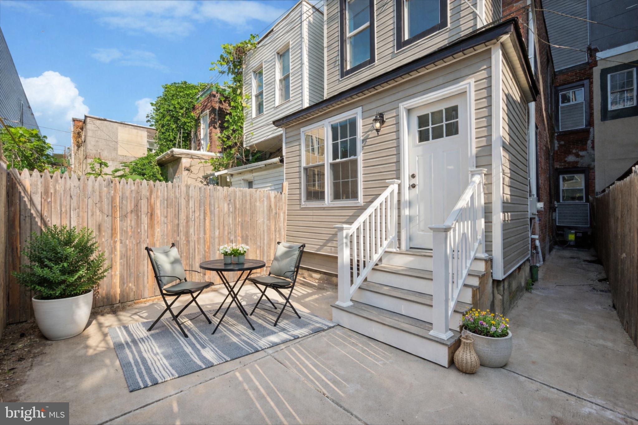 4542 Sansom Street Philadelphia, PA 19139 - Photo 36 of 36 a view of a chair and table in backyard of the house