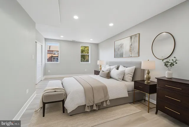 a bedroom with a bed and a dresser