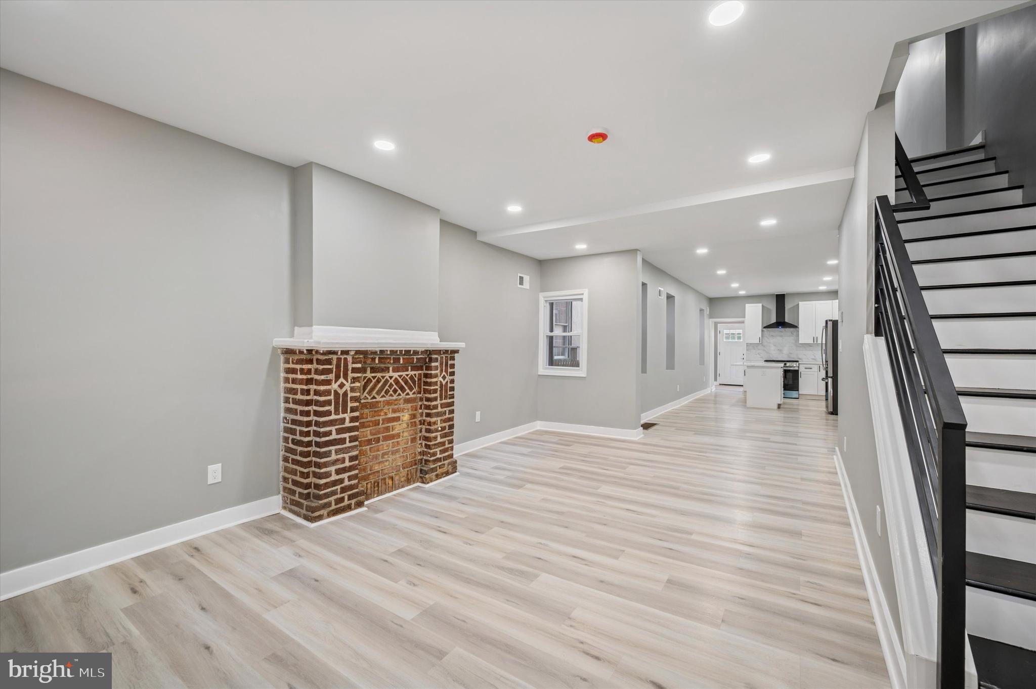 4542 Sansom Street Philadelphia, PA 19139 - Photo 5 of 36 a view of an empty room with wooden floor