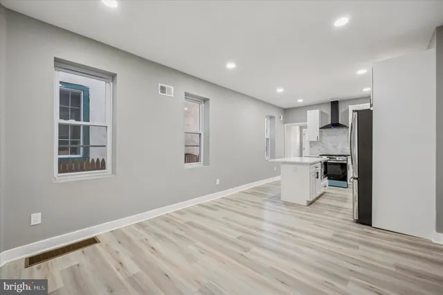 a view of a kitchen with a sink and a window