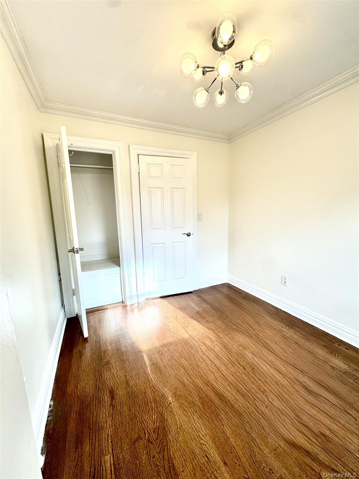1004 Balcom Avenue Bronx, NY 10465 - Photo 11 of 14 wooden floor in an empty room