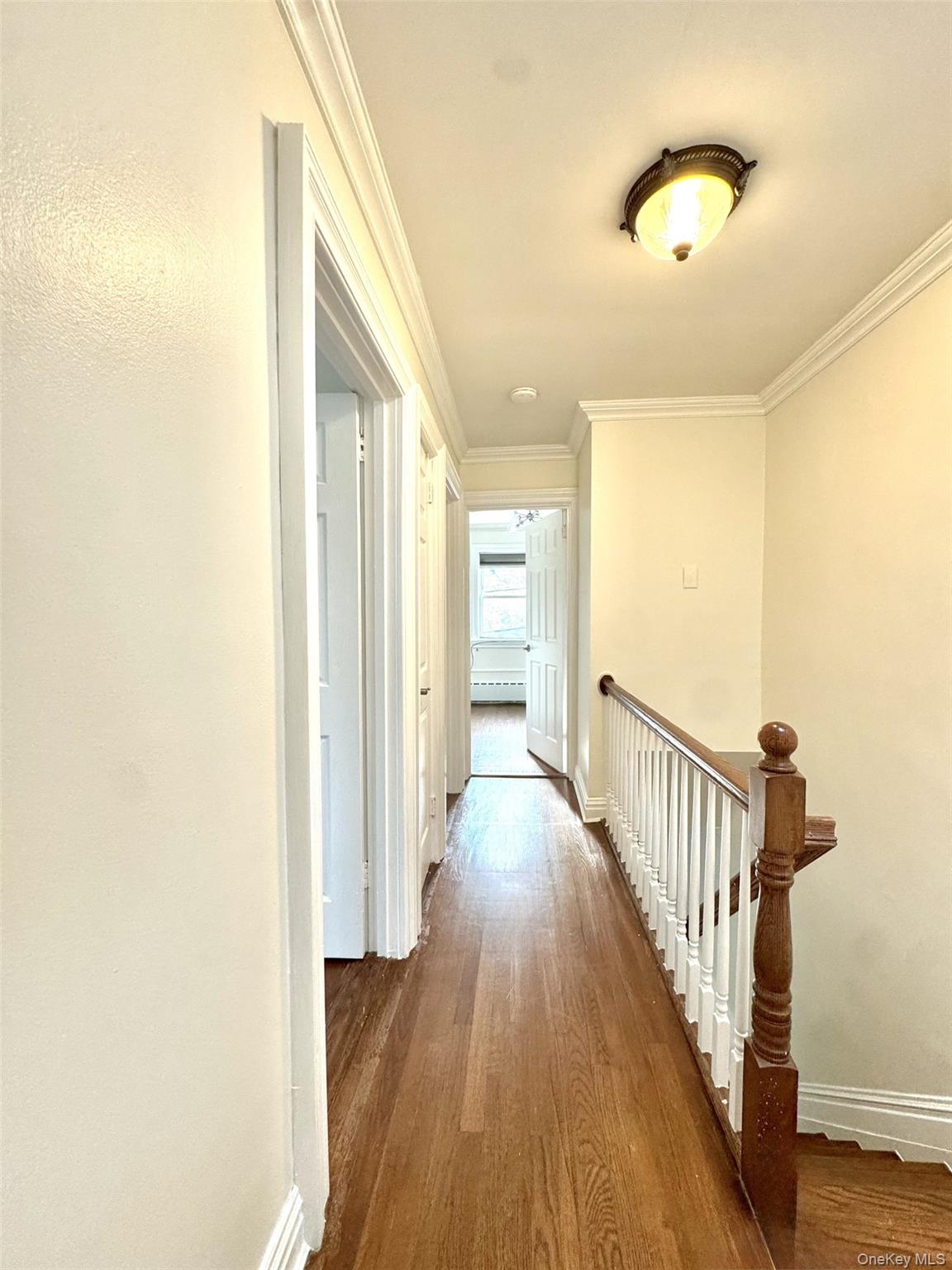 1004 Balcom Avenue Bronx, NY 10465 - Photo 13 of 14 a view of a hallway with wooden floor