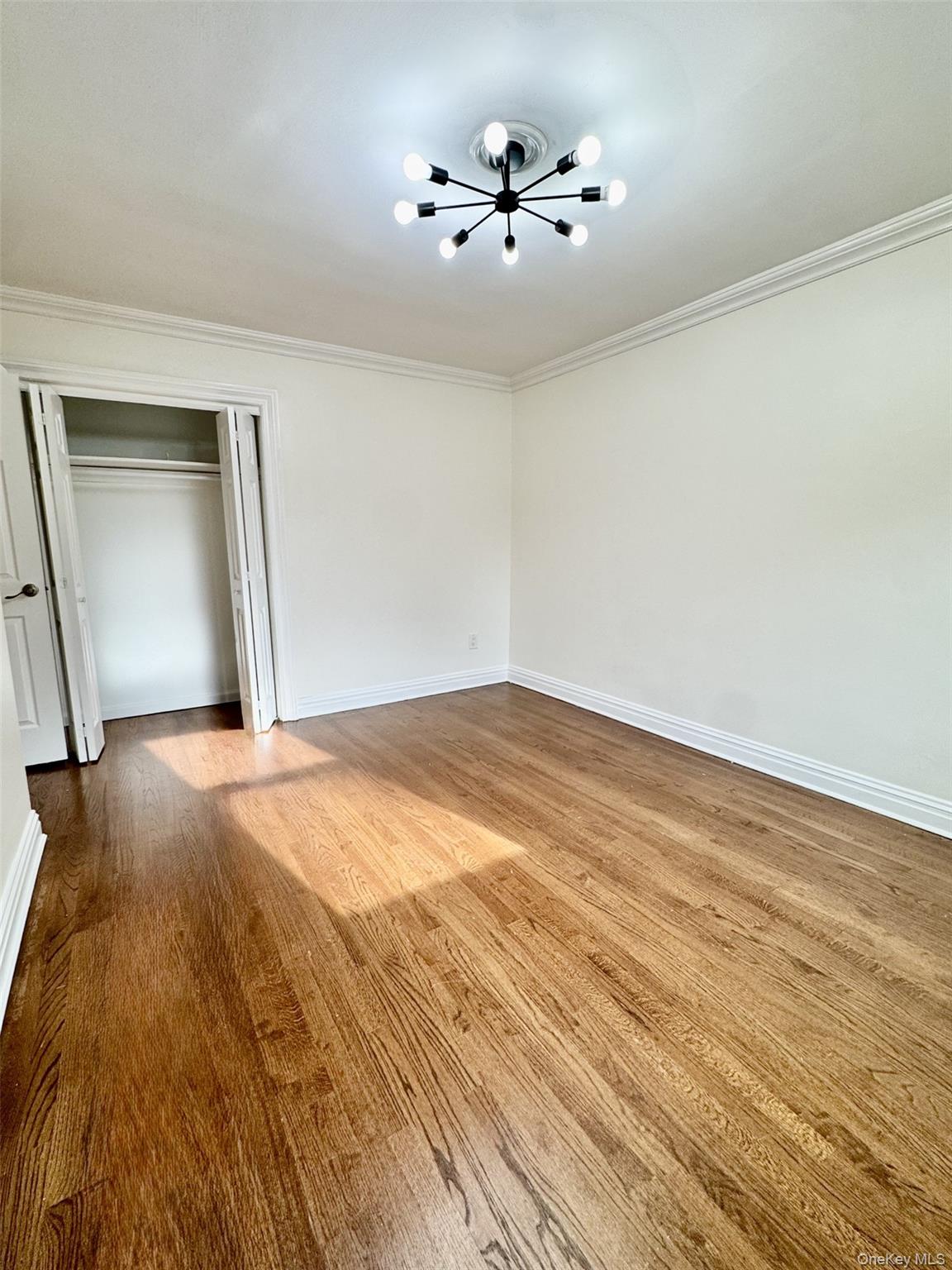 1004 Balcom Avenue Bronx, NY 10465 - Photo 10 of 14 wooden floor in an empty room