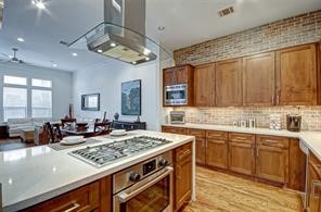 5407 Jackson Street Houston, TX 77004 - Photo 10 of 24 a view of a kitchen counter space a sink and wooden floor