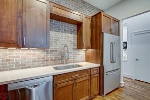 5407 Jackson Street Houston, TX 77004 - Photo 11 of 24 a kitchen with stainless steel appliances granite countertop a refrigerator and a sink
