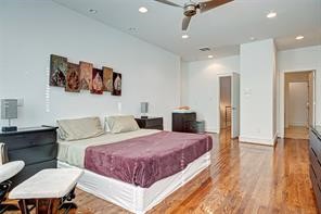 5407 Jackson Street Houston, TX 77004 - Photo 14 of 24 a bedroom with a bed a dresser and chair