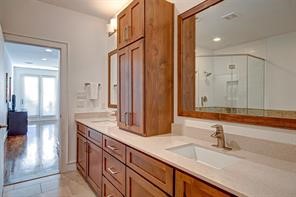 5407 Jackson Street Houston, TX 77004 - Photo 17 of 24 a bathroom with a double vanity sink and a mirror