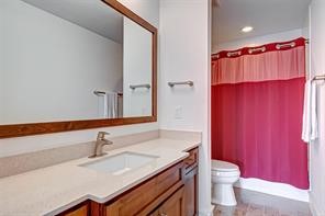 5407 Jackson Street Houston, TX 77004 - Photo 20 of 24 a bathroom with a sink a toilet and shower