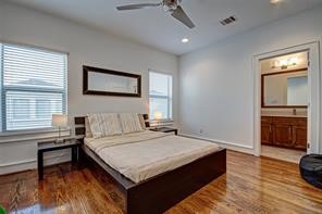 5407 Jackson Street Houston, TX 77004 - Photo 21 of 24 a bedroom with a bed and a table