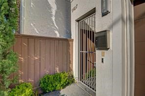 5407 Jackson Street Houston, TX 77004 - Photo 3 of 24 a view of a house with a door and wooden door