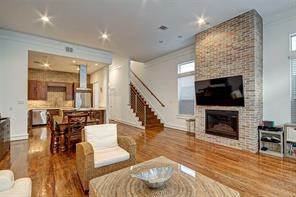 5407 Jackson Street Houston, TX 77004 - Photo 24 of 24 a living room with furniture a flat screen tv and a fireplace