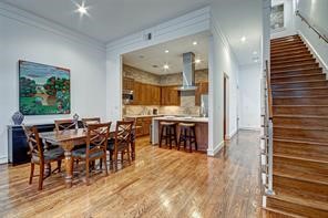 5407 Jackson Street Houston, TX 77004 - Photo 7 of 24 a large kitchen with a table and chairs in it