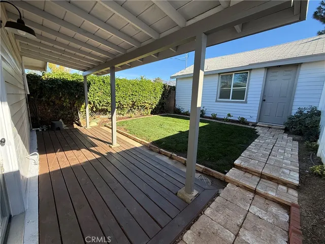 a view of porch with wooden floor