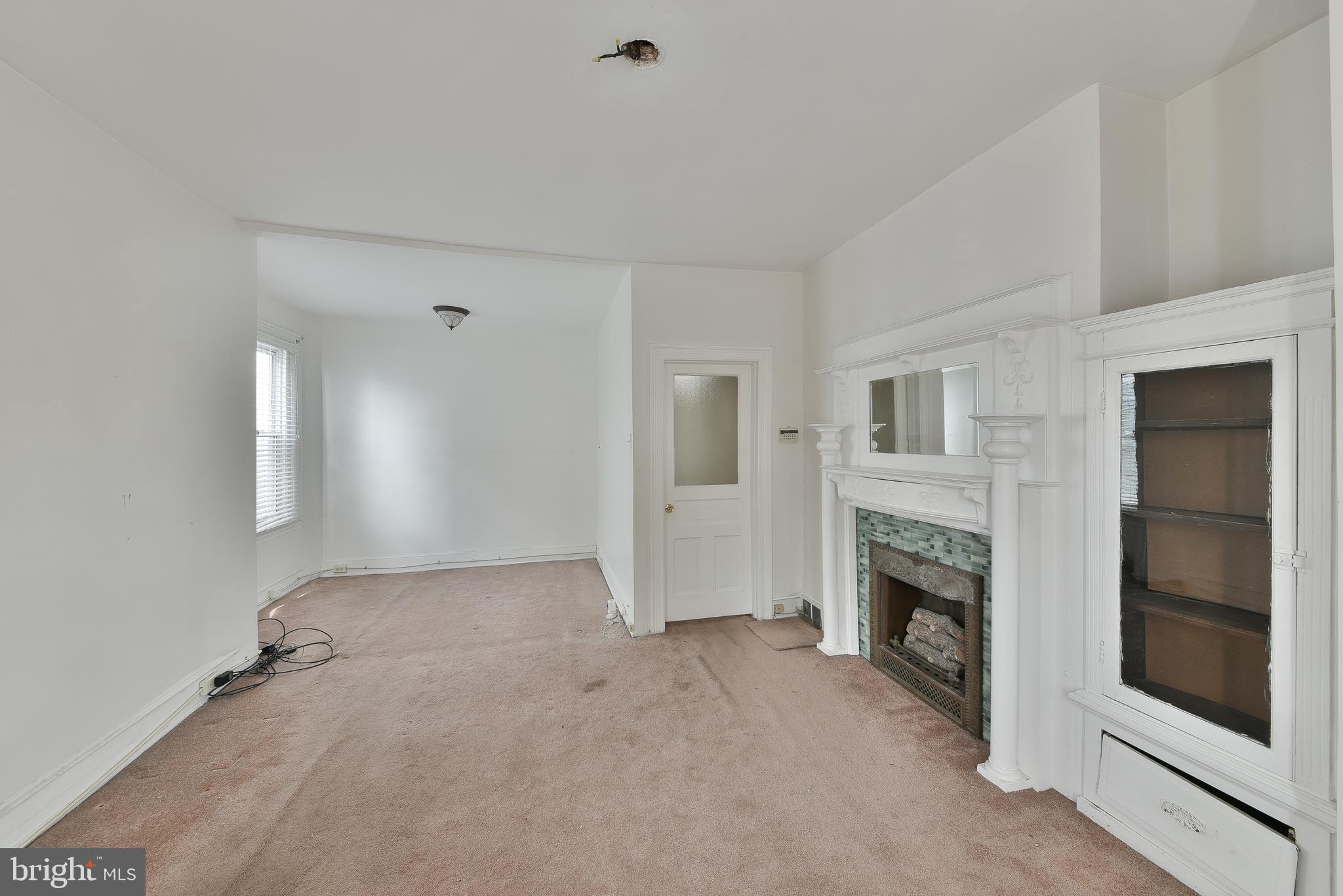 5331 Race Street Philadelphia, PA 19139 - Photo 14 of 21 a view of empty room with a fireplace and window