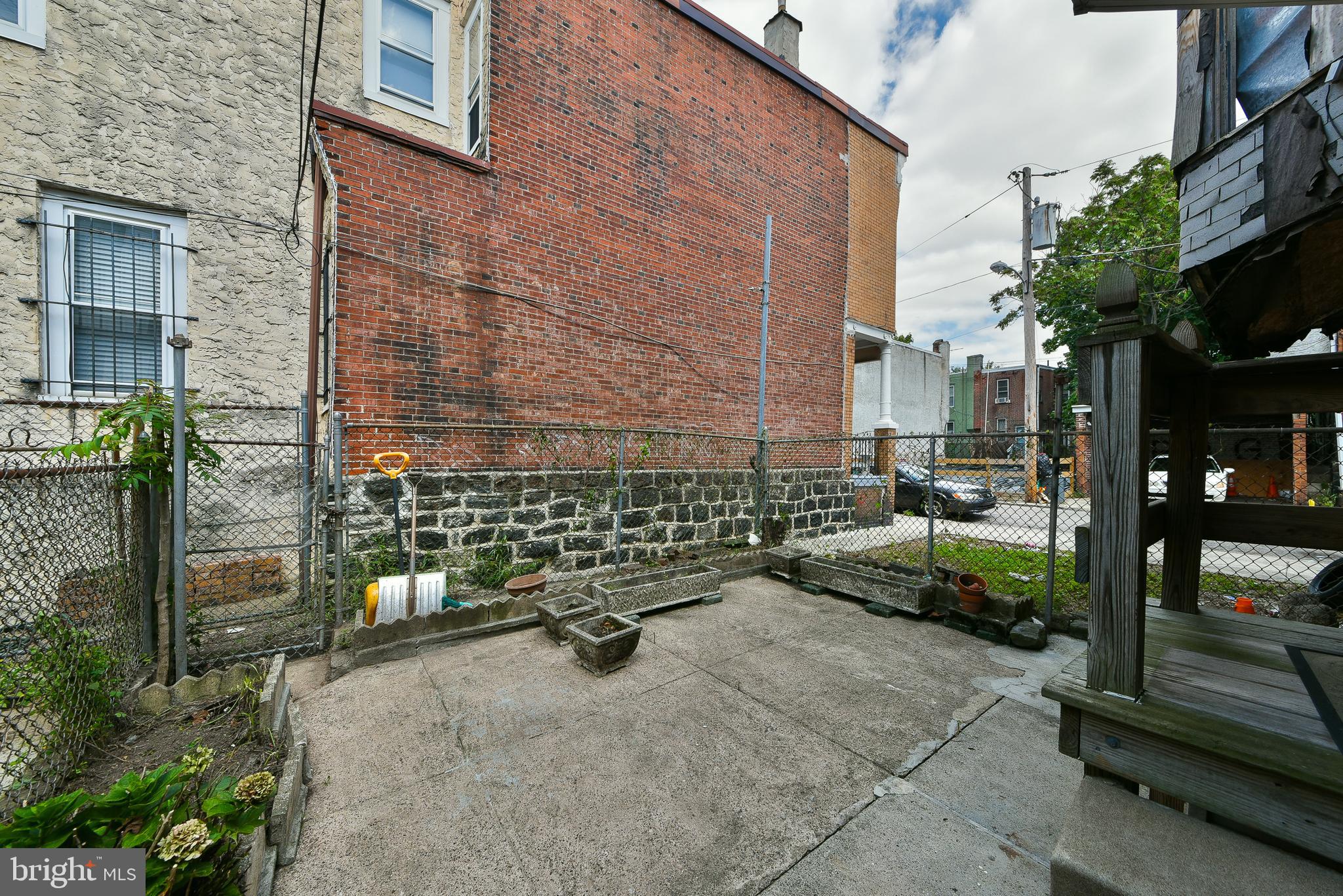 5331 Race Street Philadelphia, PA 19139 - Photo 19 of 21 a backyard of a house with barbeque oven table and chairs