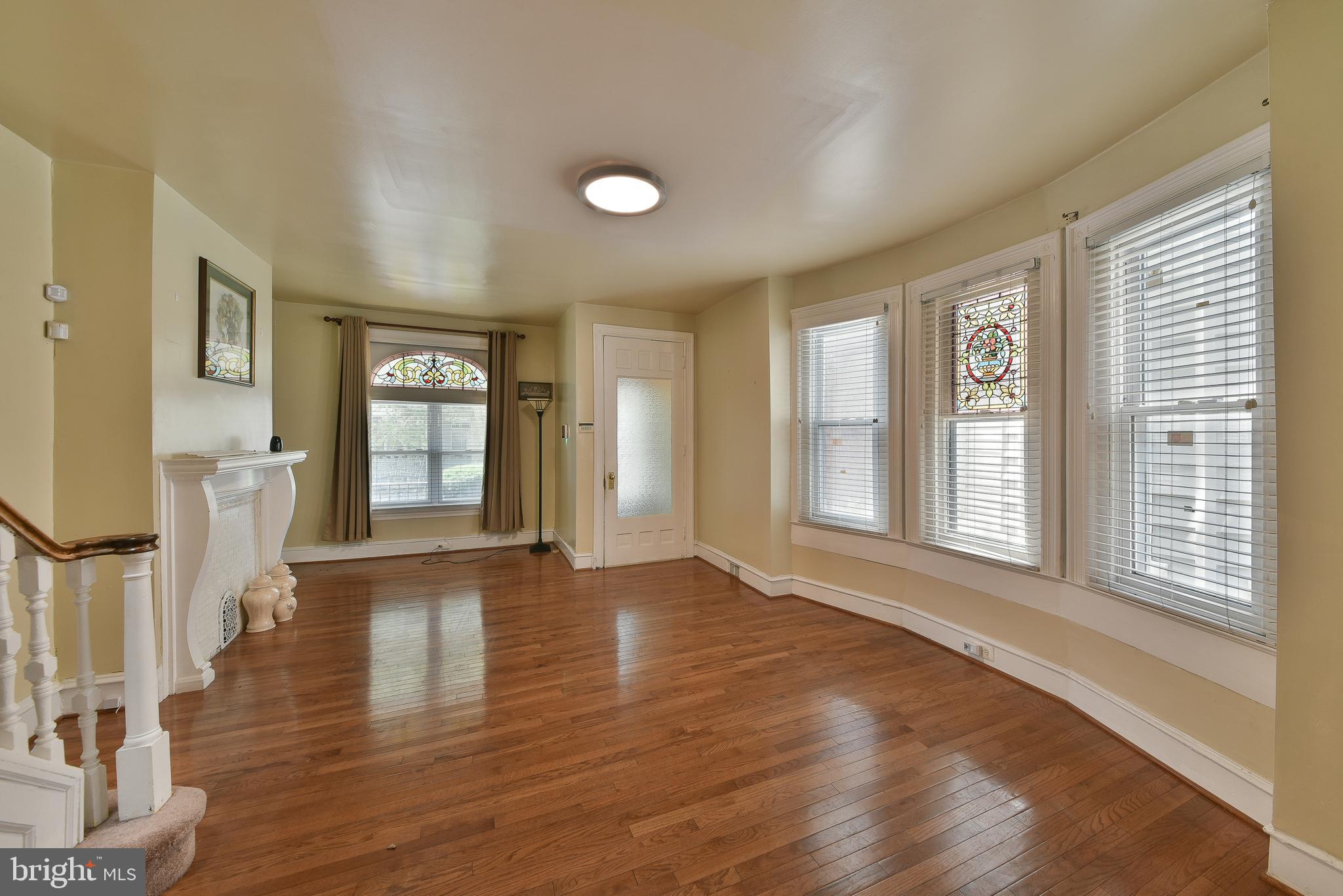 5331 Race Street Philadelphia, PA 19139 - Photo 4 of 21 a view of an empty room with wooden floor and a window
