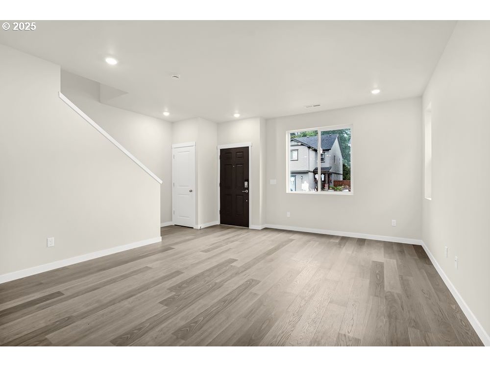 430 Southwest 32nd Street Battle Ground, WA 98604 - Photo 5 of 15 a view of an empty room with a window and wooden floor