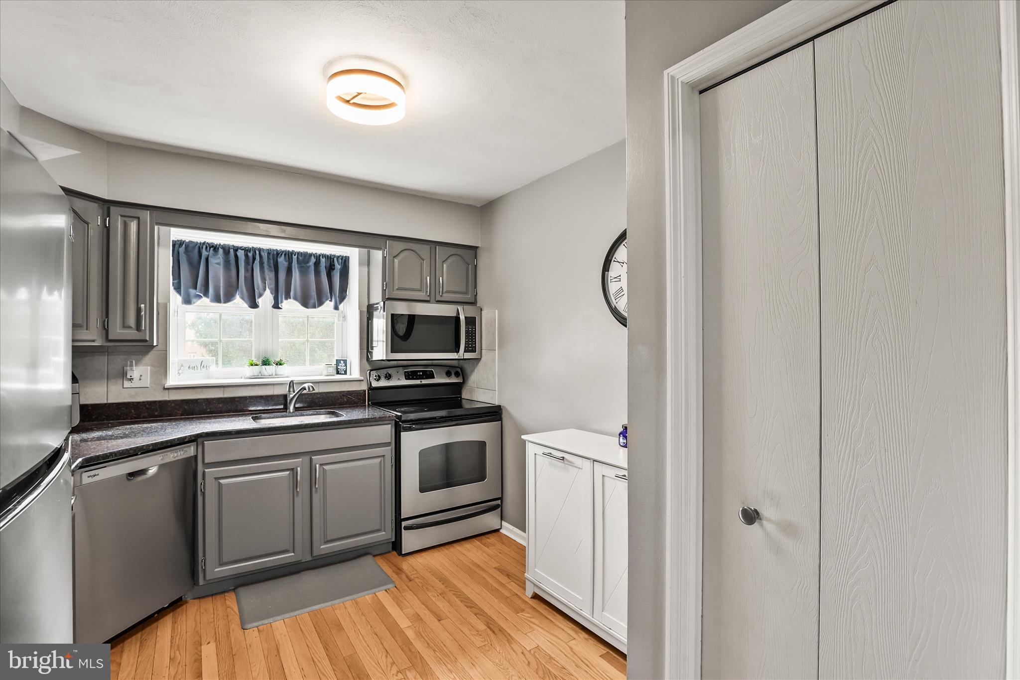 451 Weldon Drive, Unit 451 York, PA 17404 - Photo 13 of 38 a kitchen with stainless steel appliances granite countertop a sink stove and refrigerator