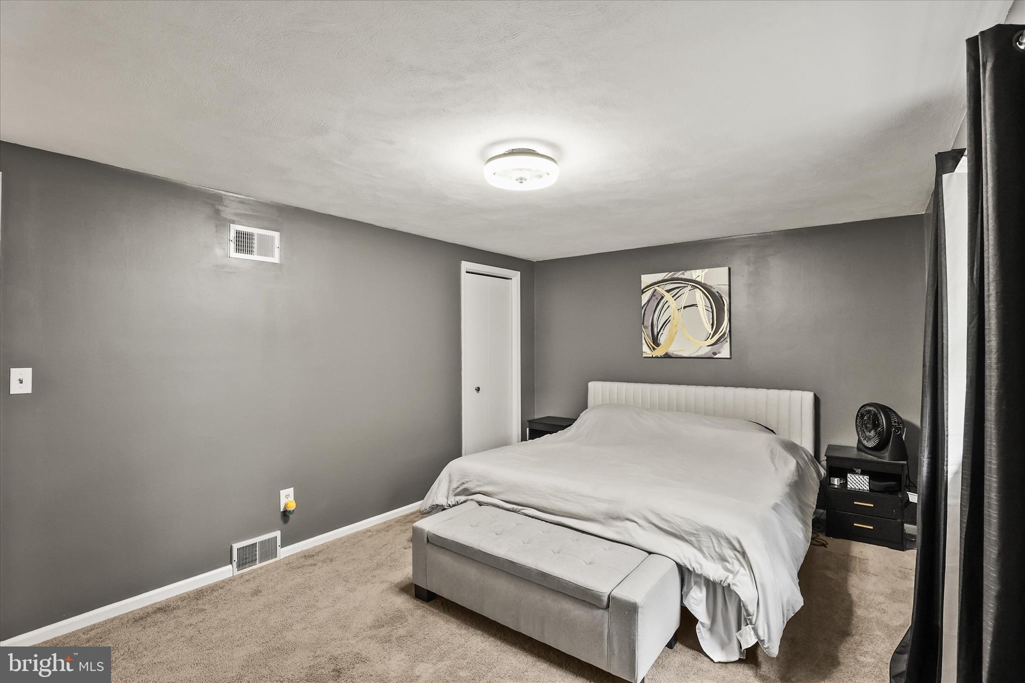 451 Weldon Drive, Unit 451 York, PA 17404 - Photo 15 of 38 a bedroom with a bed and a night stand