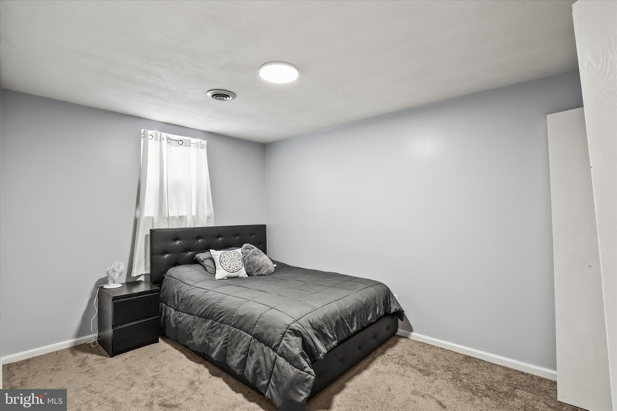 451 Weldon Drive, Unit 451 York, PA 17404 - Photo 21 of 38 a bedroom with a bed and window