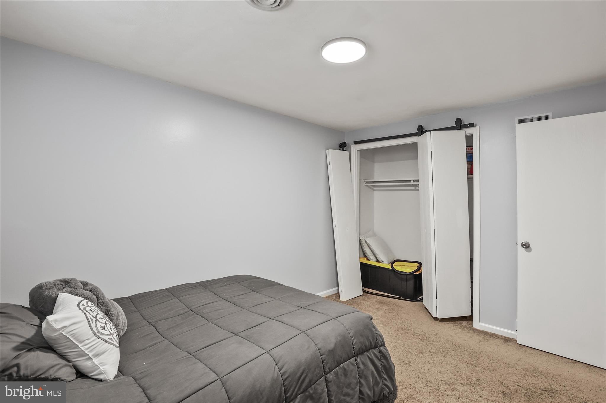 451 Weldon Drive, Unit 451 York, PA 17404 - Photo 22 of 38 a bedroom with a bed and a closet