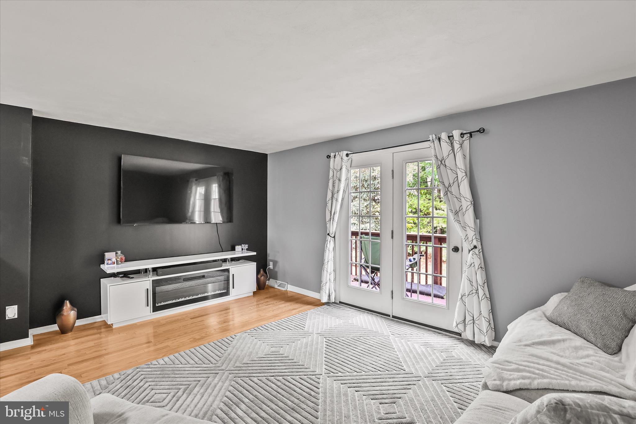 451 Weldon Drive, Unit 451 York, PA 17404 - Photo 8 of 38 a bedroom with a bed and a flat screen tv