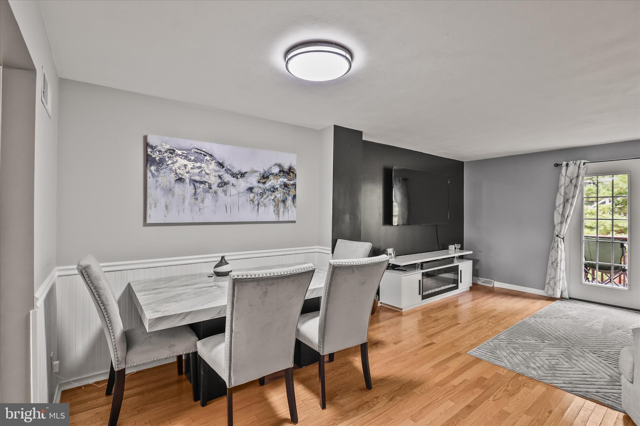 451 Weldon Drive, Unit 451 York, PA 17404 - Photo 9 of 38 a view of a workspace with furniture window and wooden floor